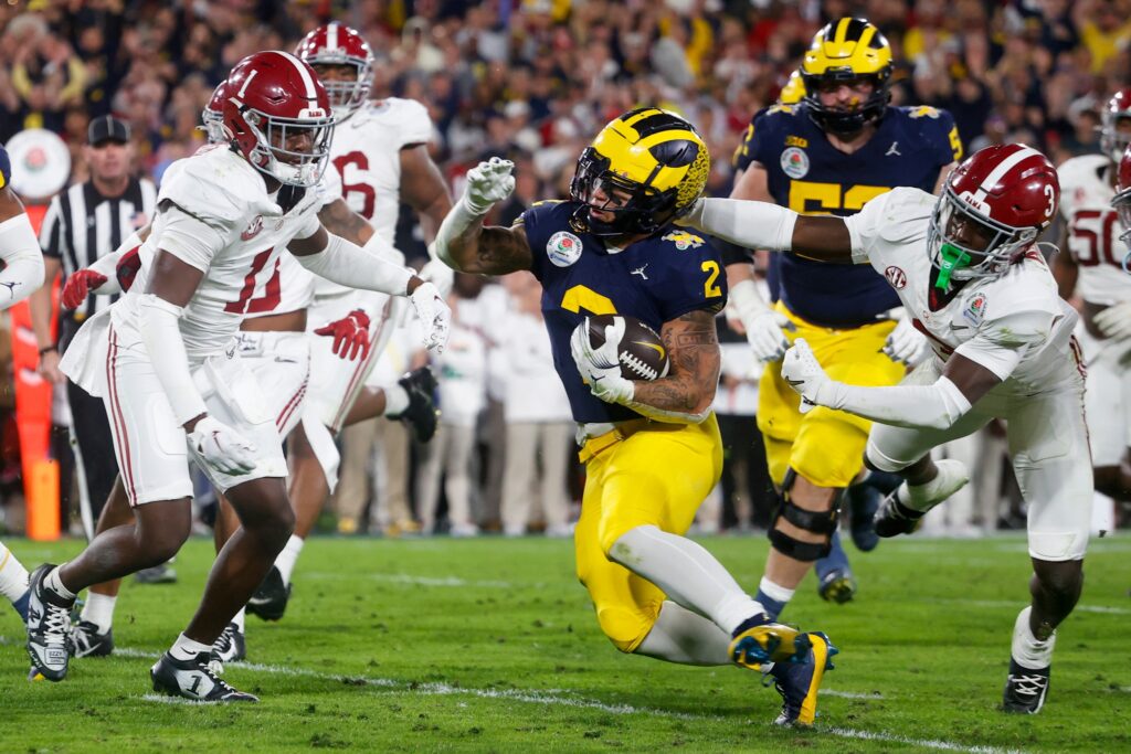 Michigan running back Blake Corum (C) runs for a touchdown during the 2024 Rose Bowl game Monday, Jan. 1, 2024, in Pasadena, Calif.