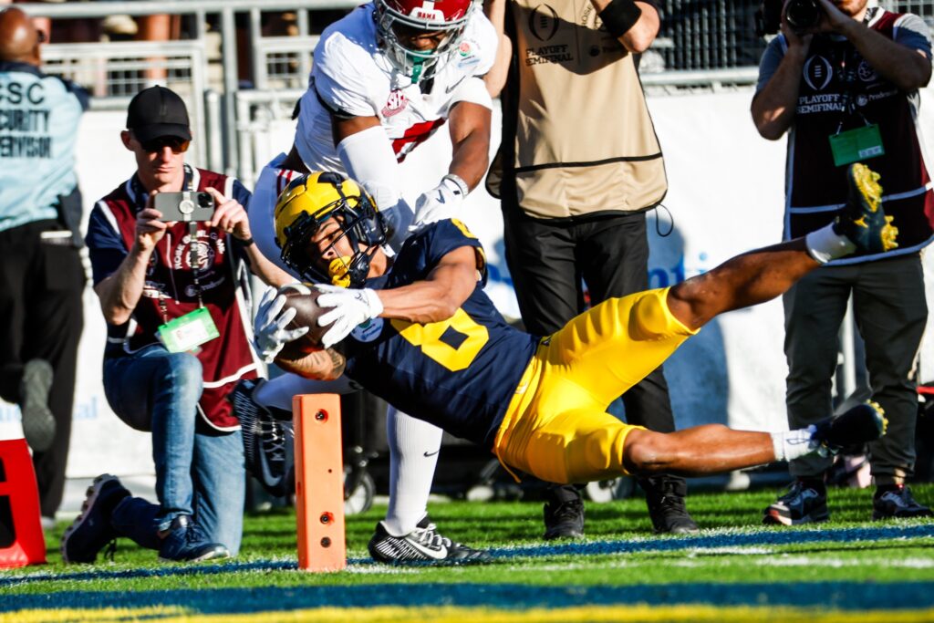 Michigan wide receiver Tyler Morris (Bottom) scores a touchdown against Alabama defensive back Jaylen Key (TOP) during the 2024 Rose Bowl game Monday, Jan. 1, 2024, in Pasadena, Calif.