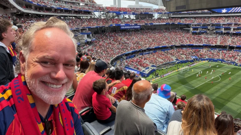 Tony Sarsam at a sold-out SoFi Stadium in Los Angeles during a FIFA World Cup 2026 match, Spain vs Austria, stands filled with fans in red behind him